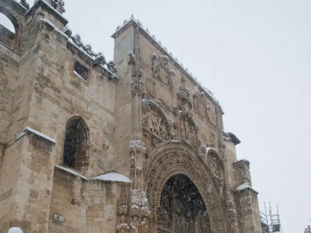 In the image there is an architecture and in front of the architecture there is a lot of snow and...
