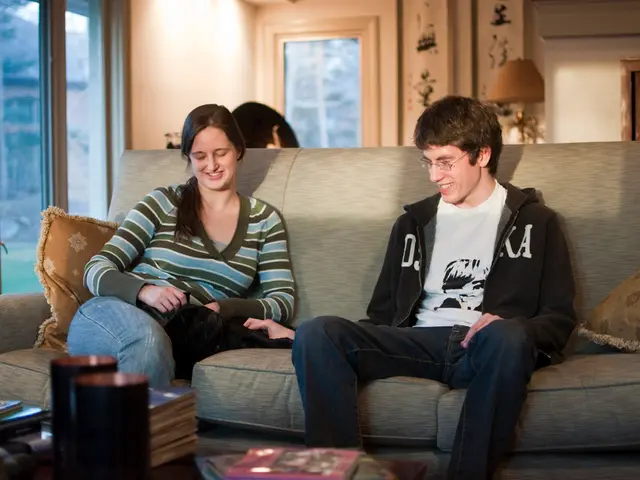 In this picture two persons sitting on the sofa and in the back ground i could see beautiful...